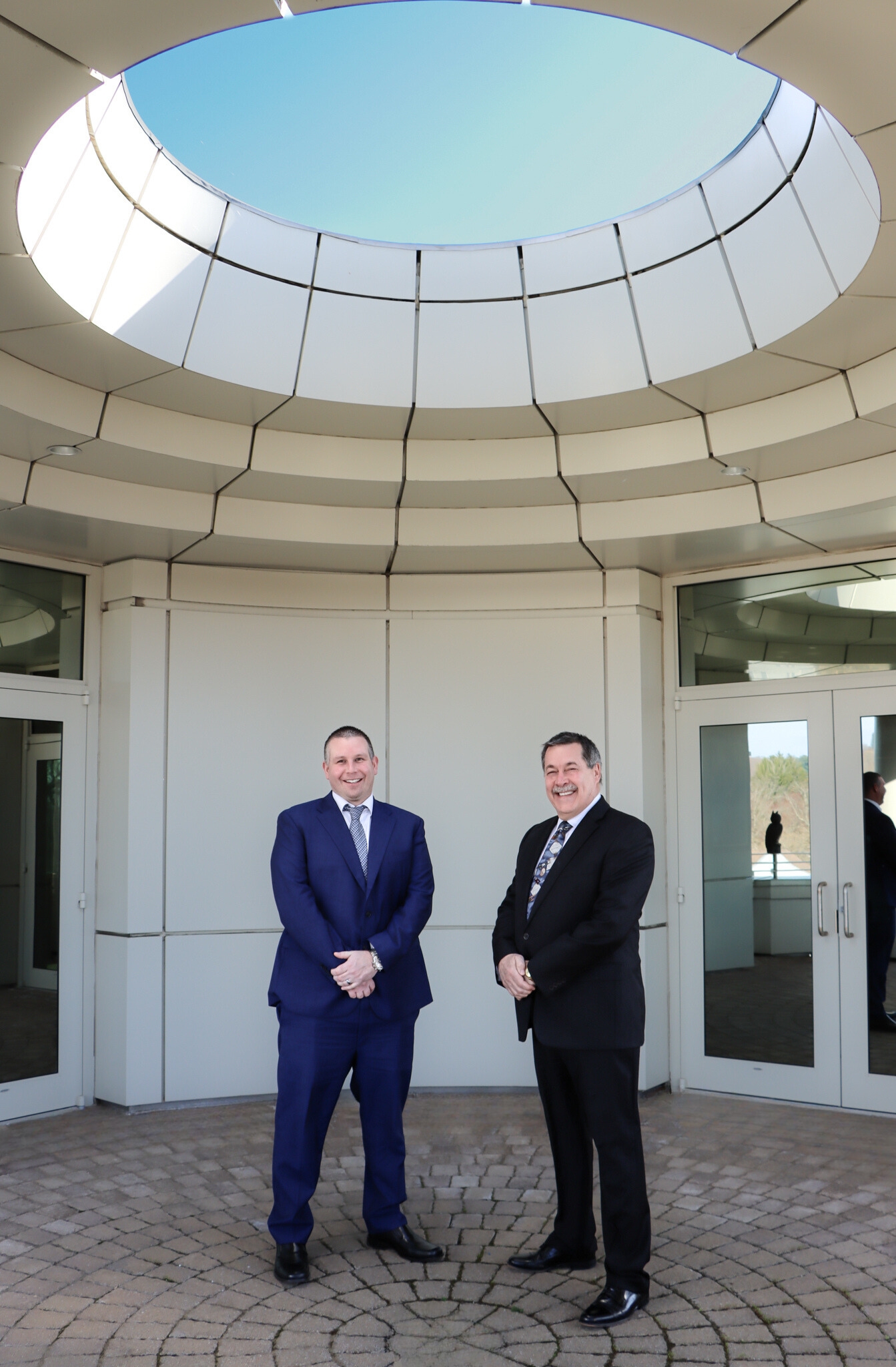 Mike Lussier and John Thomasian stand together